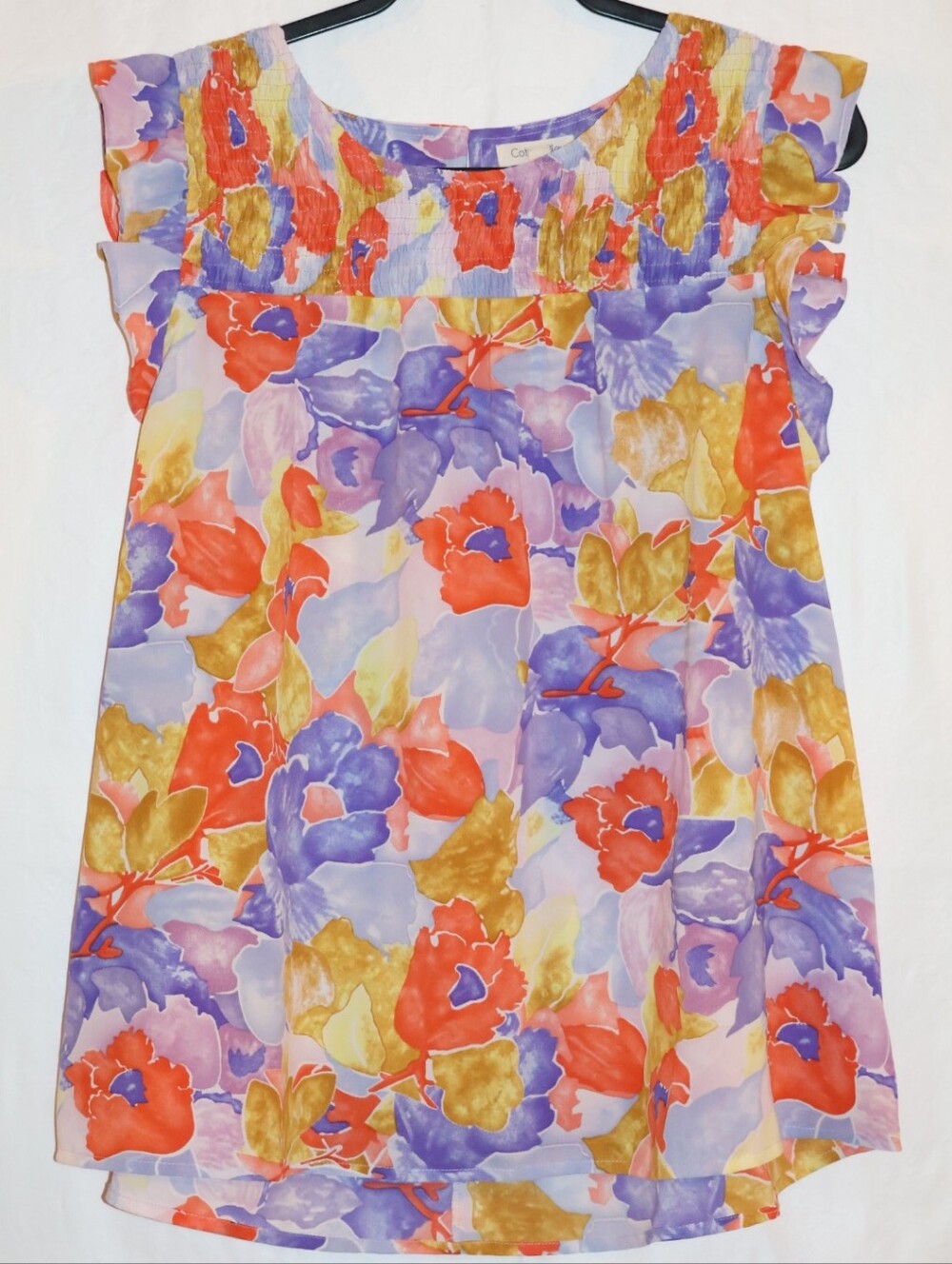 Cotton Bleu Watercolor Floral Smocked Flutter Sleeve Blouse.
